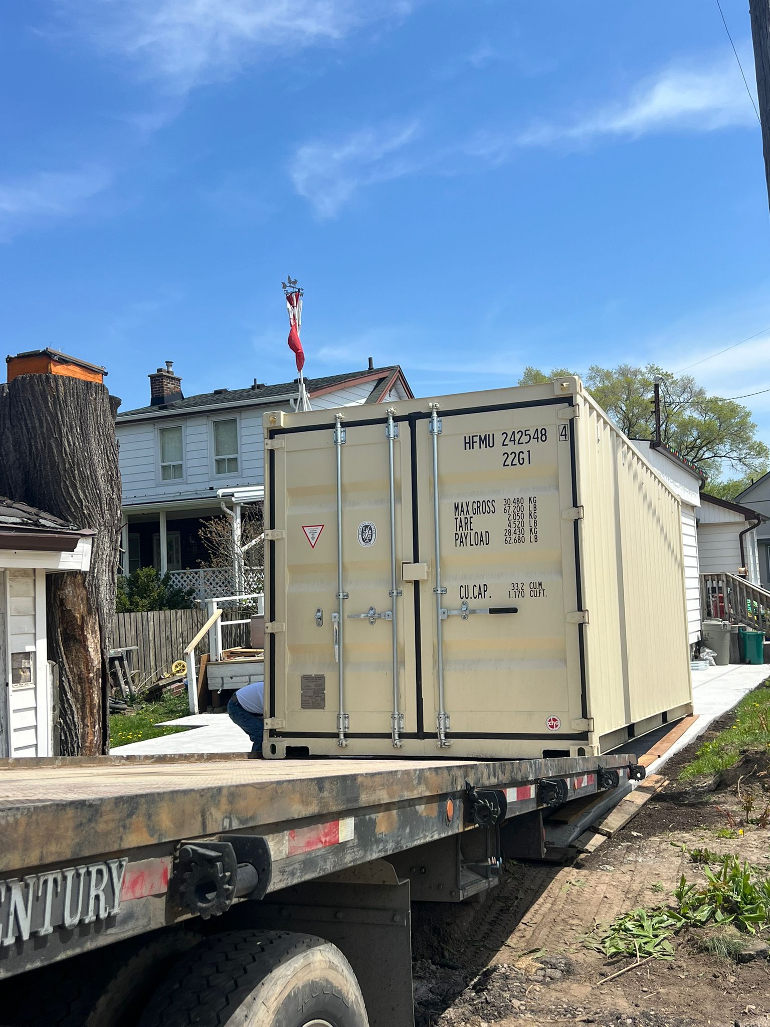 New one-trip shipping containers in multiple colours at yard