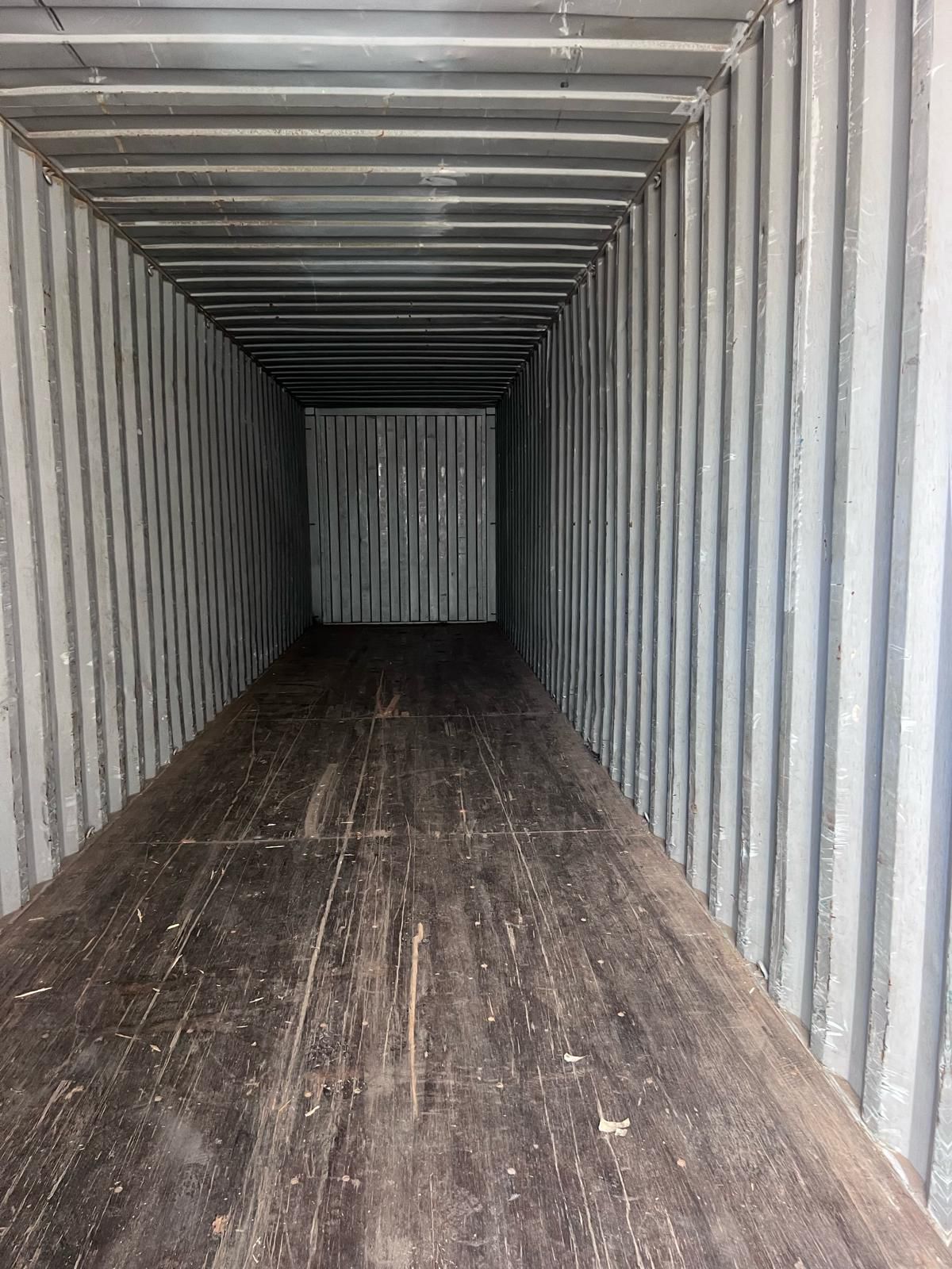 Interior of a used 40ft shipping container showing full depth, corrugated steel walls and hardwood floor — Lyonheart Containers Ontario
